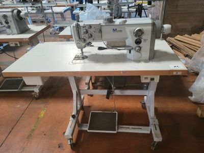 a sewing machine that is sitting on a table