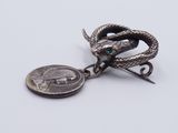 an image of a coin with a snake on it