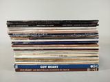 a stack of vinyl records sitting on top of each other