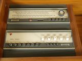 two old radio ' s sitting in a wooden box