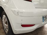 a white car that is parked in a garage