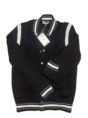 the jacket is black and white with a white stripe on it