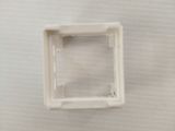 a small white square in the middle of a wall