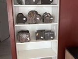 a cabinet with many items on it in a room