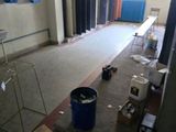 a picture of a room with a lot of trash on the floor