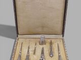 five pairs of scissors and a pair of scissors in a box