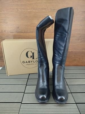 the boots are black in color and the box is brown