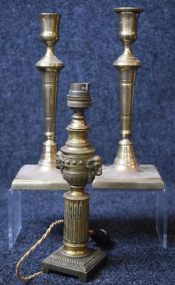 three candles that are sitting on a table