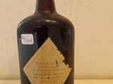 a bottle with a label on it sitting on a table