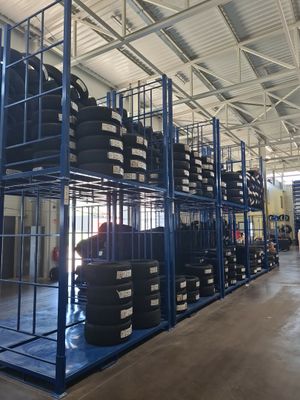 a large room with a lot of tires on the shelves