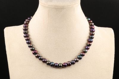 a close up of a necklace on a mannequin mannequin