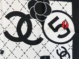 black and white scarf with black and white logo on it