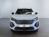 the front view of a white car in a white room