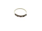 a close up of a silver ring on a white background