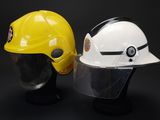 yellow and white hard hat and safety helmet on a black background