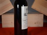 a bottle of wine that is sitting on a table