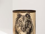 a black and white image of a bear on a brown tin