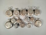 many different types of silver lockes on a table