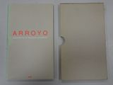 an open book with a white cover and red writing on it