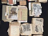 many old books on a black table with a black table cloth
