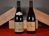two bottles of wine sitting next to each other on a table