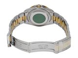 an image of a wrist watch with a green dial on a bracelet