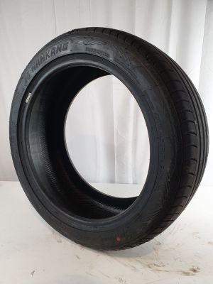 a close up of a tire on a white surface