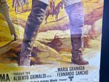 a poster of a man holding a gun in front of a wall