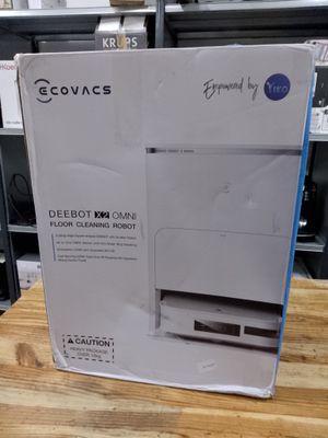 the box of the printer is open on the table in the store