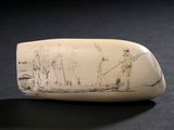 un objet blanc sur lequel figure un dessin, posé sur une table