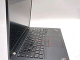 a laptop that is open on a white surface