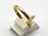 an image of a gold ring on top of a block