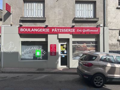 a car parked in front of a building with a sign that says boulangerie patisserierie