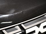 a close up of a car ' s emblem on the front of it