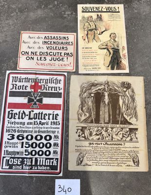 several old posters are on display on a table in a museum