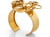 an image of a gold plated ring with scissors on it