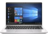 the laptop is open on a white surface with windows on the screen