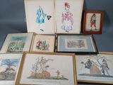 several framed and unframed drawings of people and animals on a table