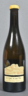 a bottle of wine that is sitting on a table