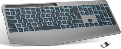 a computer keyboard and mouse on a white surface