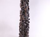 an image of a tall wooden sculpture with many animals on it