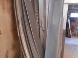 several pieces of metal are stacked on top of each other in a room