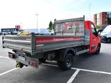 a red truck that is parked in a parking lot