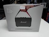 the box of the marshall portable speaker is open and ready to be used