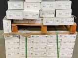 a stack of boxes sitting on a pallet in a warehouse