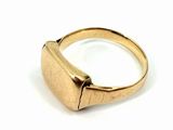 an image of a close up of a gold ring on a white surface