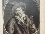 portrait of a man in a hat holding a glass of wine