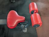 a pair of red boxing gloves sitting on the floor