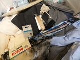 a pile of clothing and skis sitting on the floor