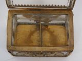 a small glass box with a mirror inside of it